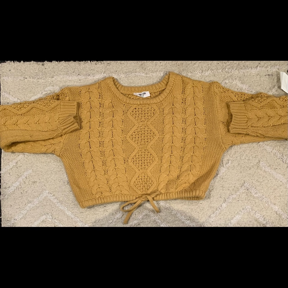 A yellow knit sweater